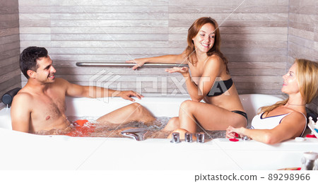 Man with two girlfriends are enjoying of relax Man with two girlfriends are enjoying of relax 89298966