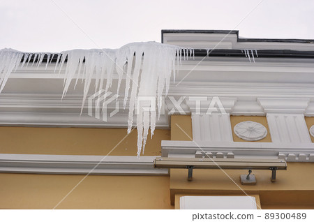 icicles hanging on the edge of the roof icicles hanging on the edge of the roof 89300489