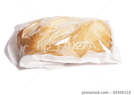 White bread in a paper bag isolated on white background White bread in a paper bag isolated on white background 89306158