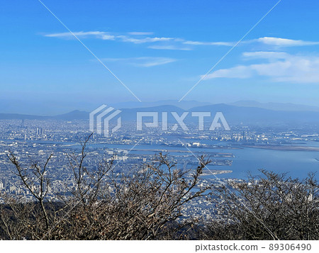 View of Osaka Plain, Mt. Nijo, Mt. Yamato Katsuragi, Mt. Kongo, etc. from the summit of Mt. Rokko over Osaka Bay 89306490