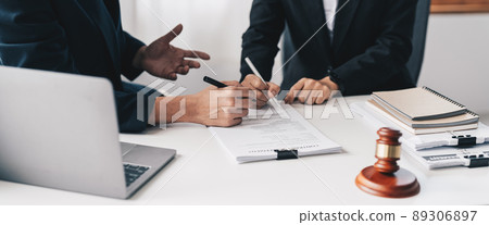 Businessman and lawyer discuss the contract document. Treaty of the law. Sign a contract business 89306897