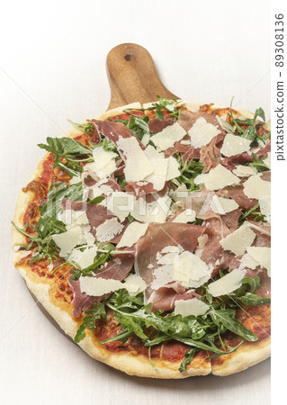parma ham, rocket and parmesan cheese gourmet pizza on white background parma ham, rocket and parmesan cheese gourmet pizza on white background 89308136