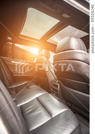 Car inside. Interior of prestige modern car. Comfortable leather seats. Black cockpit with on isolated white background. Car inside. Interior of prestige modern car. Comfortable leather seats. Black cockpit with on isolated white background. 89308246