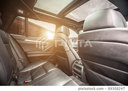 Car inside. Interior of prestige modern car. Comfortable leather seats. Black cockpit with on isolated white background. 89308247