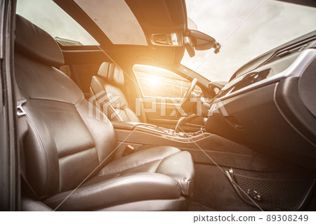 Car inside. Interior of prestige modern car. Comfortable leather seats. Black cockpit with on isolated white background. Car inside. Interior of prestige modern car. Comfortable leather seats. Black cockpit with on isolated white background. 89308249
