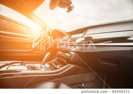 Car inside. Interior of prestige modern car. Comfortable leather seats. Black cockpit with on isolated white background. Car inside. Interior of prestige modern car. Comfortable leather seats. Black cockpit with on isolated white background. 89308251