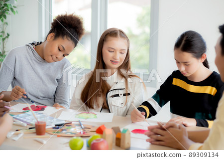 Group of student sitting and studying and learning drawing with teacher together in classroom. 89309134