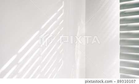 Architectural shadows. Sunlight architecture abstract background with light, black shadow overlay from window on white texture wall. Mockups, posters, stationary, wall art, design presentation. 89310107