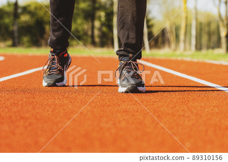 Walking on a running track 89310156