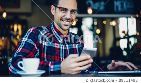 Skilled freelancer with netbook Skilled freelancer with netbook 89311488