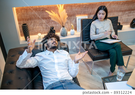 Young male patient undergoing the talk therapy 89312224