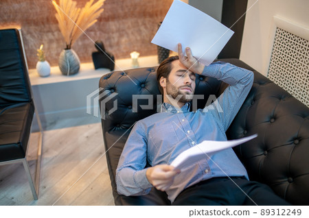 Young businessman suffering from the entrepreneurial burnout Young businessman suffering from the entrepreneurial burnout 89312249