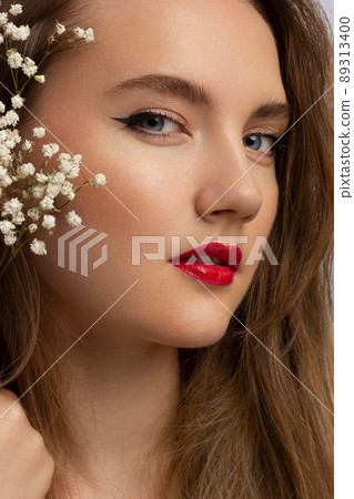 Evening style. Alluring woman with luxury fashion make-up, red lips makeup and long hair. Trends colors, marsala wine color lipstick, strong eyebrows, sexy hair. cosmetology, make up, injections, spa Evening style. Alluring woman with luxury fashion make-up, red lips makeup and long hair. Trends colors, marsala wine color lipstick, strong eyebrows, sexy hair. cosmetology, make up, injections, spa 89313400