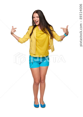 Young casual woman pointing at herself cheering happy standing in full length Young casual woman pointing at herself cheering happy standing in full length 89314006