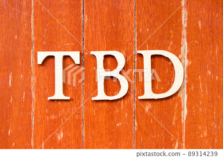 Alphabet letter in word TBD (Abbreviation of to be defined, discussed, determined, decided, deleted or declared) on old red color wood plate background 89314239