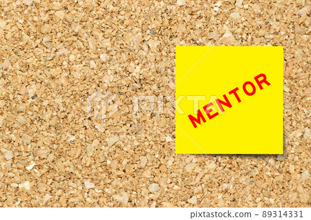 Yellow note paper with word mentor on cork board background with copy space Yellow note paper with word mentor on cork board background with copy space 89314331