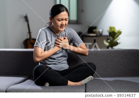 Asian woman was sick with chest pain. Asian woman was sick with chest pain. 89314637