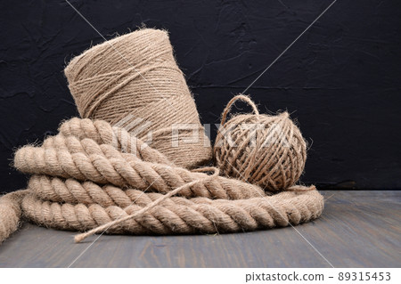 Jute rope and spools of burlap threads or twine Jute rope and spools of burlap threads or twine 89315453