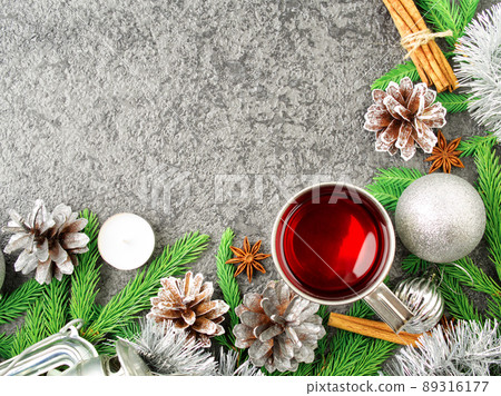 Christmas and Happy New Year background with tea. Top view, copy space, military stile. Fir branches, silver concrete 89316177