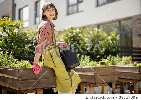 Portrait of young gardener at backyard 89317399