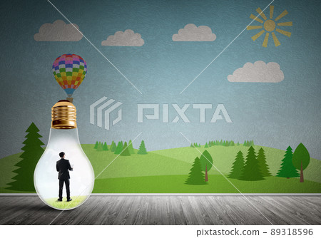 Businessman trapped in bulb Businessman trapped in bulb 89318596
