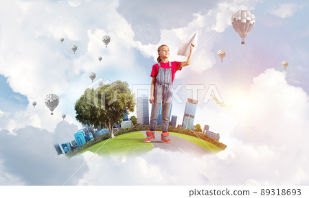 Concept of careless happy childhood with girl dreaming about future 89318693