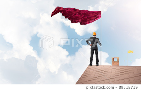 Young businessman with flag presenting concept of leadership. Mixed media Young businessman with flag presenting concept of leadership. Mixed media 89318719