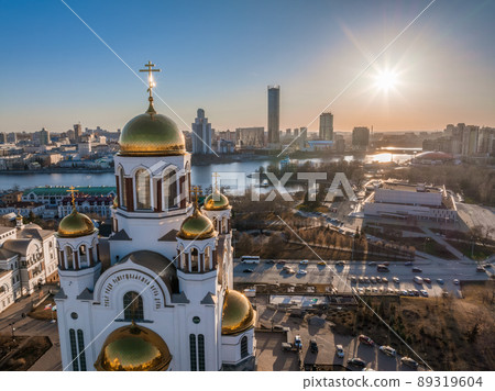 Early spring or autumn Yekaterinburg and Temple on Blood in clear sunset. Aerial view of Yekaterinburg, Russia. Translation of the text on the temple 89319604