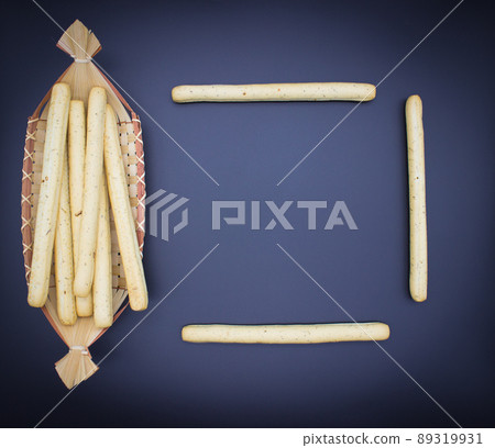 Breadsticks on dark background Breadsticks on dark background 89319931