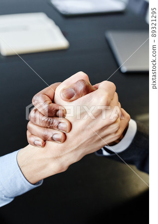 Business Partners Shaking Hands Top View Business Partners Shaking Hands Top View 89321295