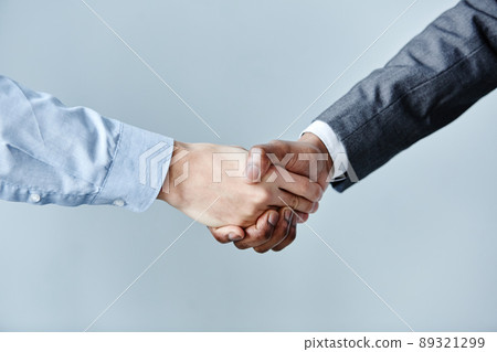 Handshake on Blue Closeup Handshake on Blue Closeup 89321299
