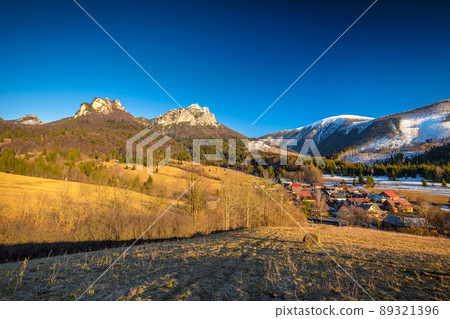 Rural landscape with mountain peaks on background in early sprin 89321396