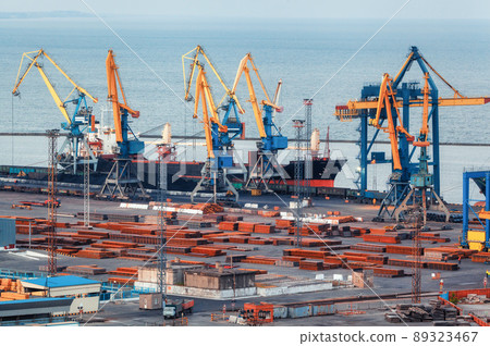 Sea commercial port at night in Mariupol, Ukraine before the war. Industrial. Cargo freight ship Sea commercial port at night in Mariupol, Ukraine before the war. Industrial. Cargo freight ship 89323467