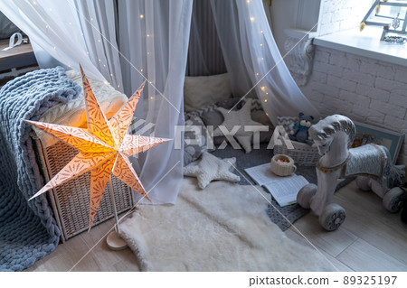 Childen's room corner with a beautifully decorated play tipi tent. Wigwam Childen's room corner with a beautifully decorated play tipi tent. Wigwam 89325197