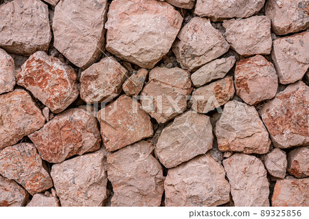 Marble bricks stone wall close-up . marble bricks texture of the walls. marble pattern of the brick wall. stone fence. Marble bricks stone wall close-up . marble bricks texture of the walls. marble pattern of the brick wall. stone fence. 89325856