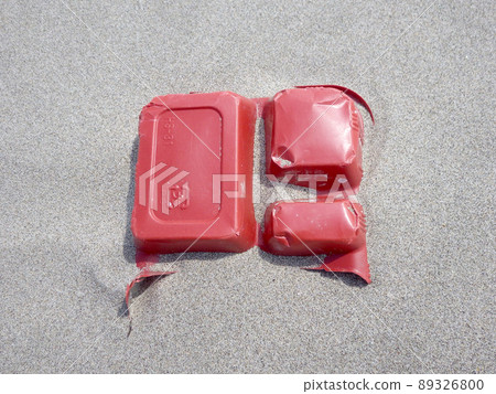Marine plastic garbage, food containers washed ashore on the beach 89326800