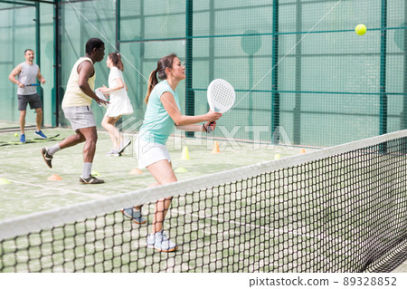 Portrait of young woman during padel training 89328852