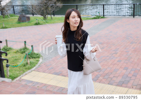 Woman climbing stairs over coffee 89330795