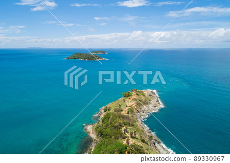 Amazing landscape nature scenery view of Beautiful tropical sea with Sea coast view in summer season image by Aerial view drone top down, high angle view Located at Laem Promthep Phuket Thailand 89330967