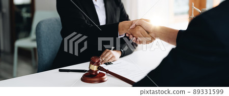 Businessman shaking hands to seal a deal Judges male lawyers Consultation legal services Consulting in regard to the various contracts to plan the case in court 89331599