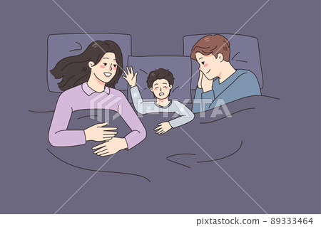 Happy family with kid sleeping in bed Happy family with kid sleeping in bed 89333464