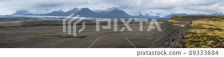 Iceland autumn tundra landscape near Haoldukvisl glacier, Iceland. Glacier tongue slides from the Vatnajokull icecap or Vatna Glacier near subglacial Esjufjoll volcano. Not far from Iceland Ring Road. 89333684