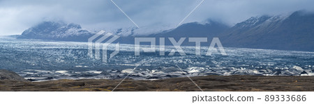 Iceland autumn tundra landscape near Haoldukvisl glacier, Iceland. Glacier tongue slides from the Vatnajokull icecap or Vatna Glacier near subglacial Esjufjoll volcano. Not far from Iceland Ring Road. Iceland autumn tundra landscape near Haoldukvisl glacier, Iceland. Glacier tongue slides from the Vatnajokull icecap or Vatna Glacier near subglacial Esjufjoll volcano. Not far from Iceland Ring Road. 89333686