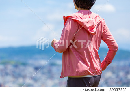 Japanese middle-aged woman exercising outdoors Japanese middle-aged woman exercising outdoors 89337231