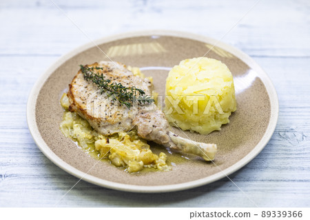 pork chop with thyme baked on creamy onion with mashed potatoes 89339366