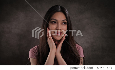 Studio portrait of a pretty Asian girl Studio portrait of a pretty Asian girl 89340585