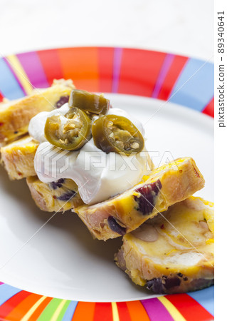 bean dumplings with sour cream and jalapenos 89340641