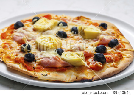 pizza with ham, black olives and artichokes pizza with ham, black olives and artichokes 89340644