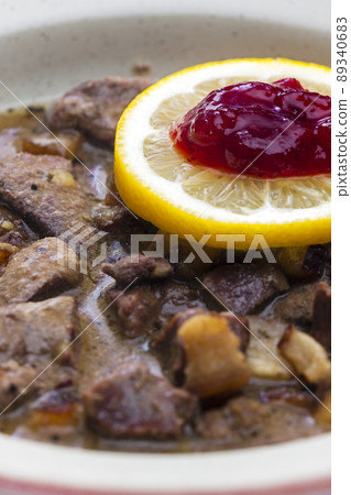 venison goulash with lemon and cranberries 89340683