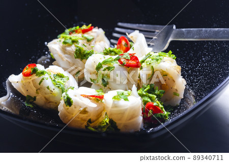 marinated sepia with parsley and chilli pepper filled with rice 89340711